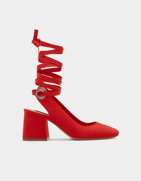 Red high heel shoes with a tied detail