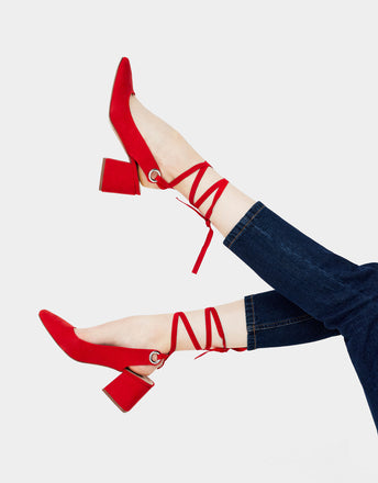 Red high heel shoes with a tied detail