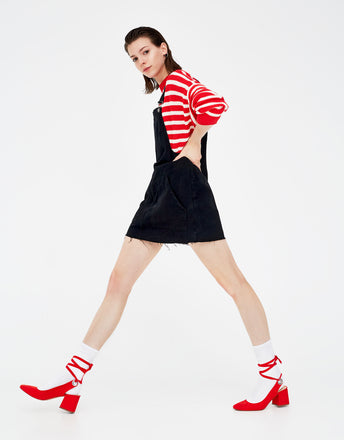 Red high heel shoes with a tied detail